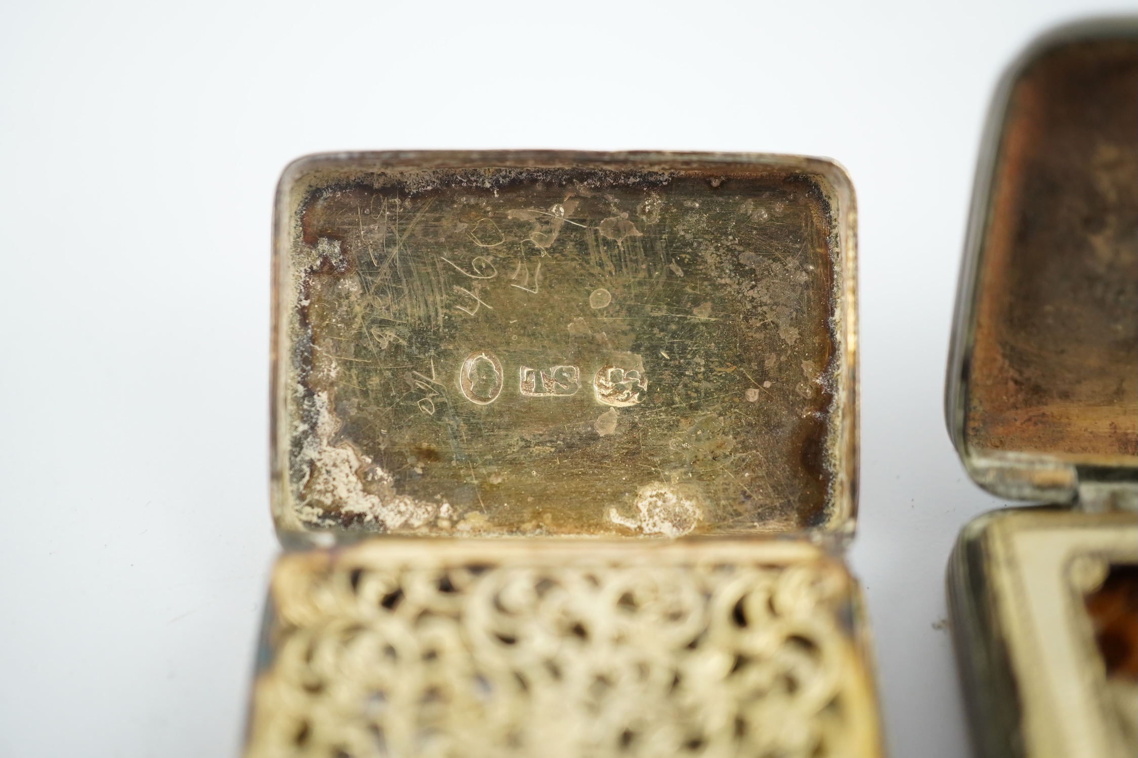 A William IV silver rectangular vinaigrette, William Stroud, Birmingham, 1833, 30mm and two other vinaigrettes. Condition - poor to fair